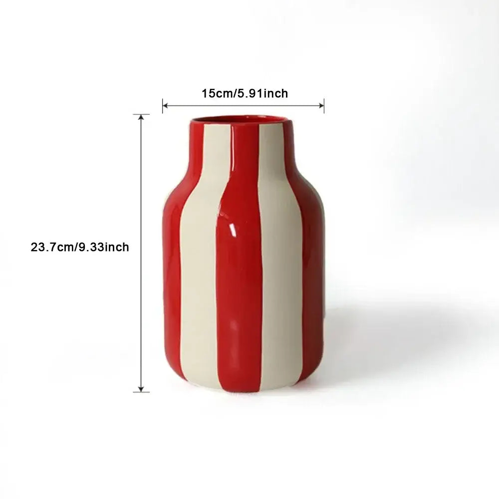 A glossy red and cream striped ceramic vase with a rounded bottle shape in ceramic vase black red striped design