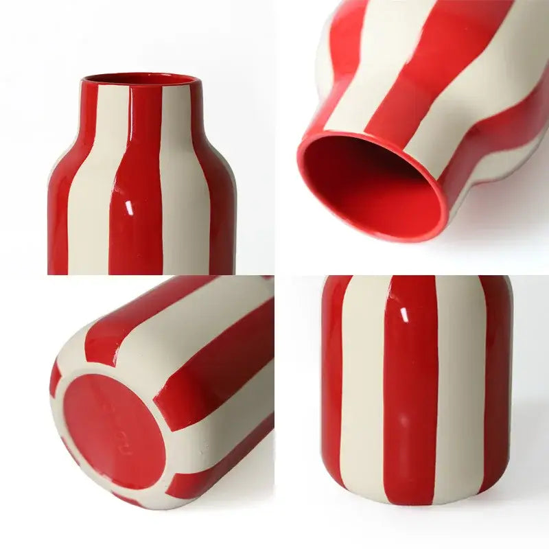 A glossy red striped ceramic vase with white accents and a modern curved design perfect for home decor