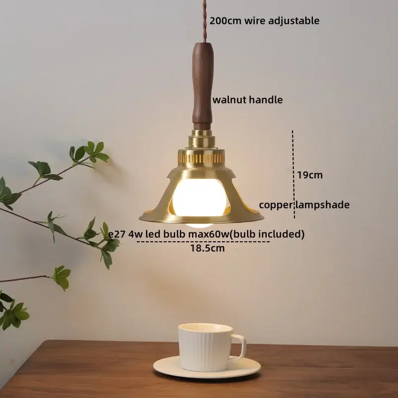 A brass bell-shaped ceramic walnut copper pendant light with a walnut handle and copper lampshade for decorbites decor