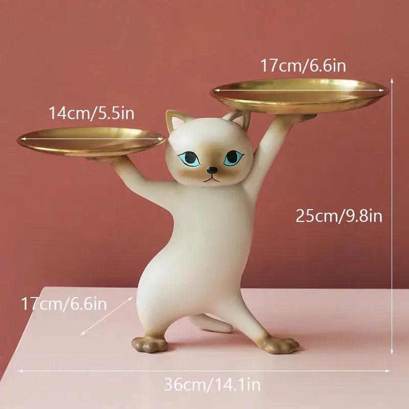 Cream-colored ceramic cat figurine with blue eyes holding gold-plated trays for cat figurines storage tray use