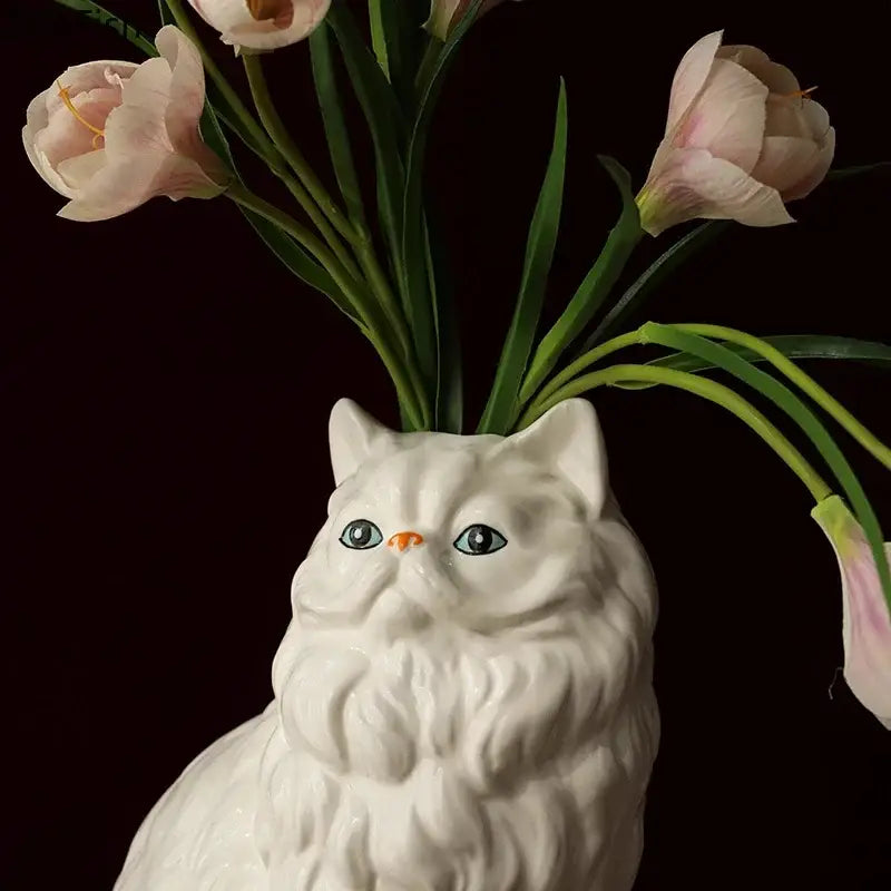 Ceramic white cat vase from decorbites with detailed fur texture and painted blue eyes for desk and living room decor