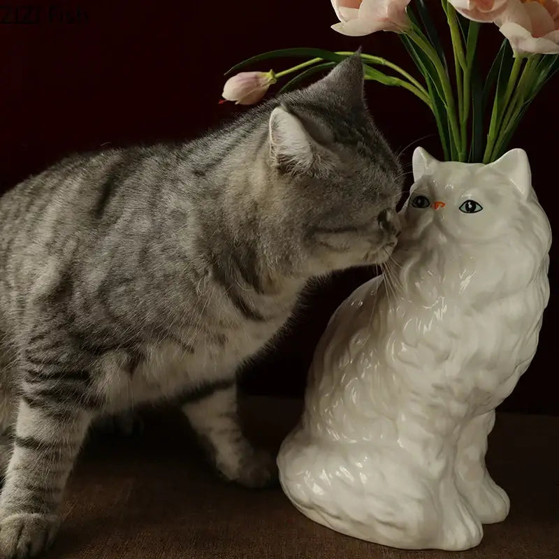 Ceramic white cat vase with textured fur and blue eyes holding pink tulips for desk and living room decorbites ceramic white