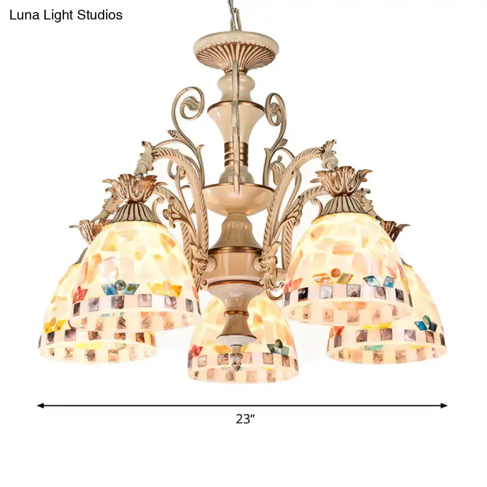 Beige mosaic chandelier with ornate metal arms and colorful stained glass panels in tiffany style pendant light design