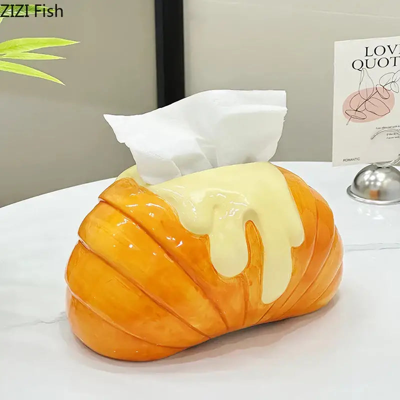 Charming orange and yellow croissant ceramic tissue box with icing drizzle by decorbites for bedroom decor