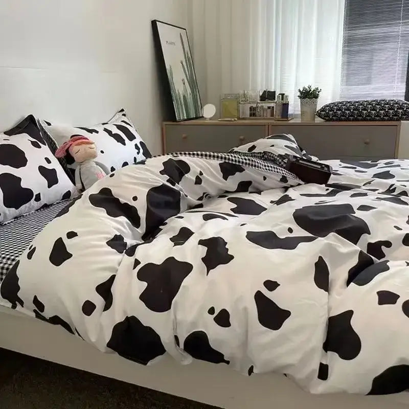 Checkerboard black and beige satin duvet cover set featuring a black and white cow print cover set for bedroom bedding