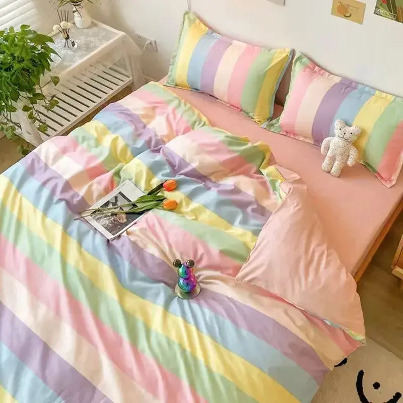 Pastel rainbow striped duvet cover set with matching pillowcases displayed alongside checkerboard black and beige satin duvet cover set bedroom bedding