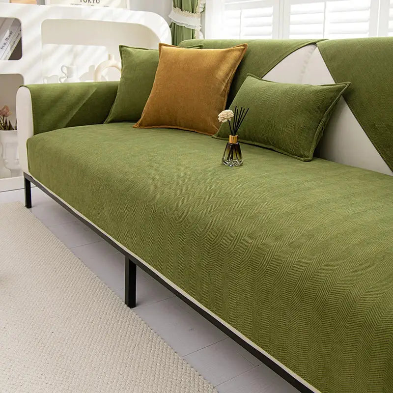Olive green chenille textured non slip sofa cover with herringbone pattern white trim and black metal legs for living room sofa cushion