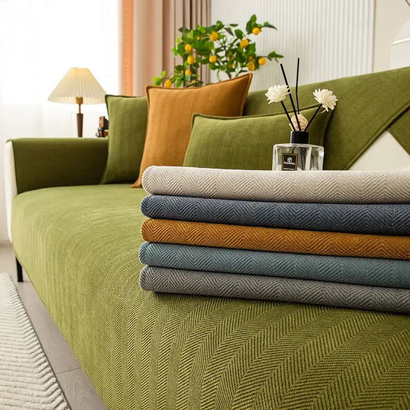 Stack of five chenille textured non-slip herringbone sofa covers in beige navy mustard and gray for living room sofa cushion