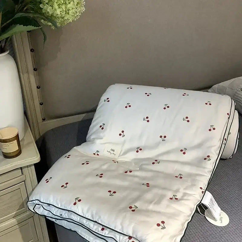 White quilt with red cherry embroidery and black piping edges decorbites cooling quilt for bedroom use