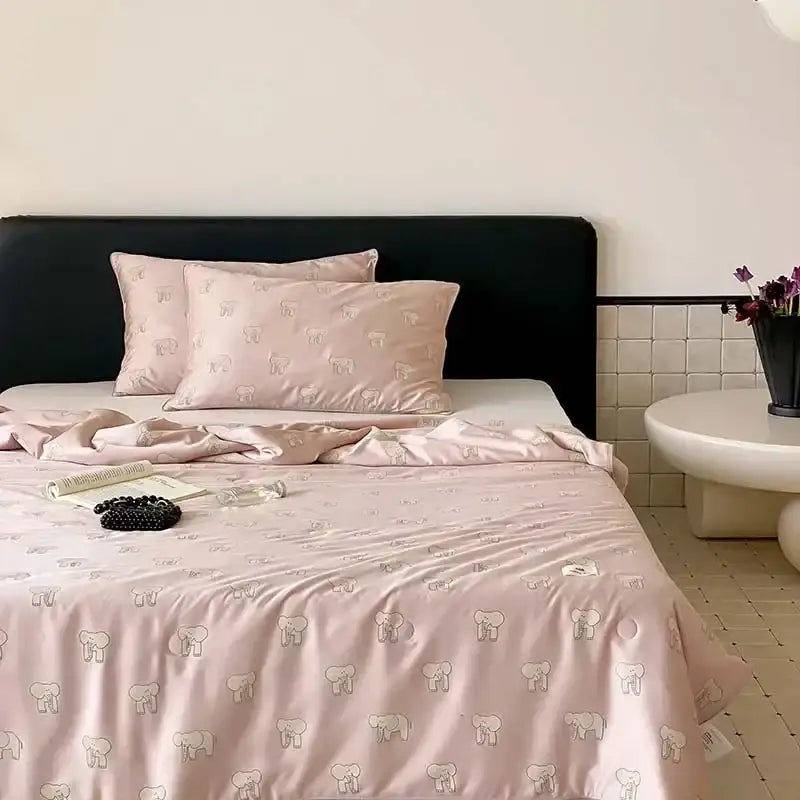 Pink satin bedding set with subtle gray elephants and cherry embroidery cooling quilt by decorbites
