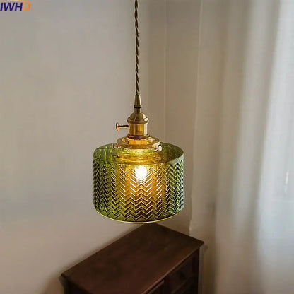 Chevron green glass pendant light with brass hardware featuring a chevron pattern for kitchen lighting