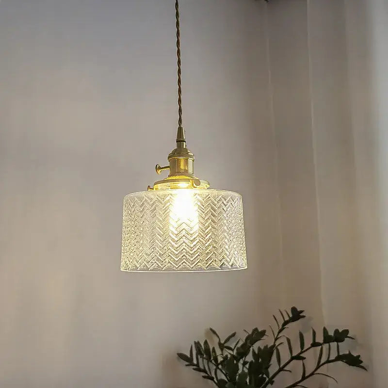 Chevron green glass pendant light featuring warm-toned etched glass shade and brass-finished metal fixture pendant light