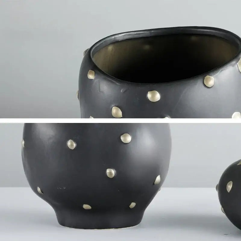 Chic black resin flower pot with gold accent featuring a black ceramic vase adorned with scattered gold-toned studs