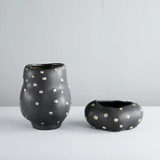 Chic black resin flower pot with gold accent featuring black ceramic vases with silver metallic studs for decorbites black resin decor