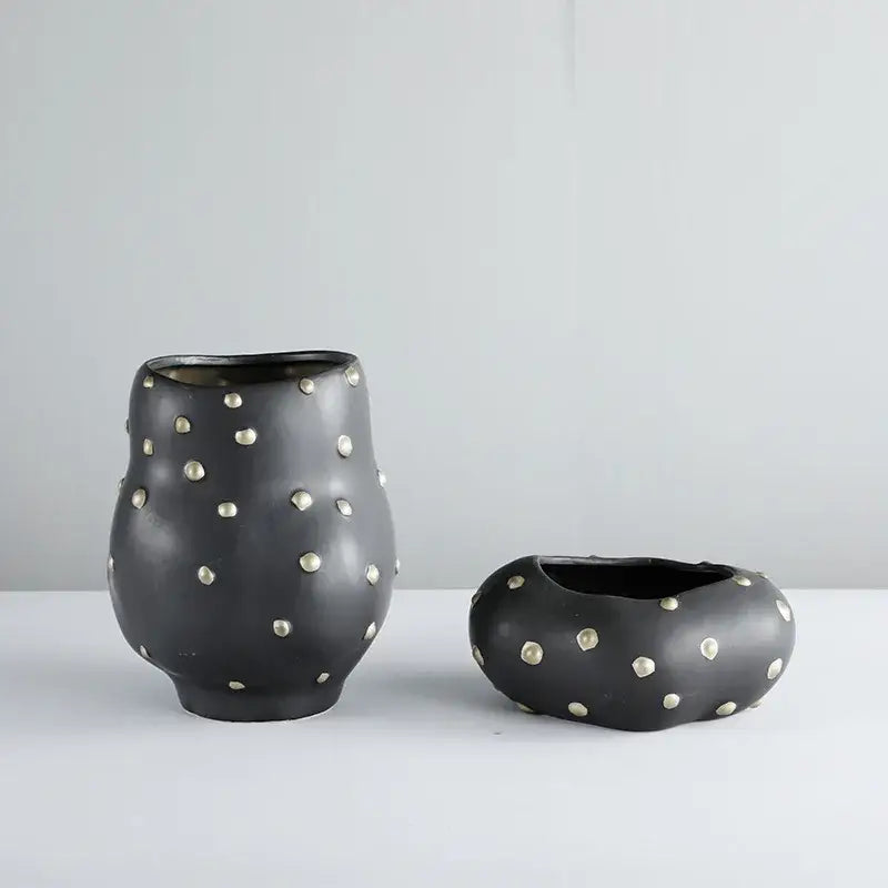 Chic black resin flower pot with gold accent featuring black ceramic vases with silver metallic studs for decorbites black resin decor