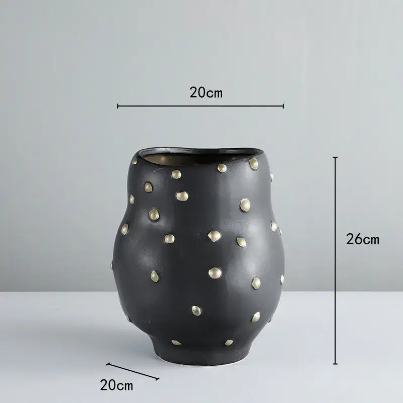 Chic black resin flower pot with gold accent featuring black ceramic vase with metallic gold studs for living room decorbites black resin