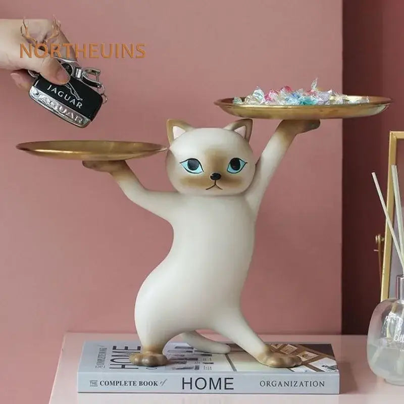 Chic cream and gold decorbites cat resin tray featuring a ceramic cat figurine with blue eyes balancing two trays