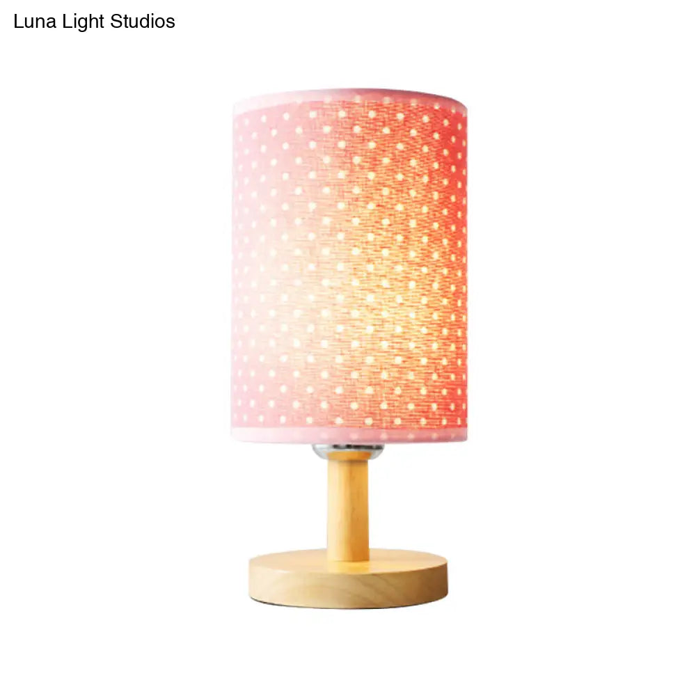 Lámpara de escritorio rosa infantil: Lámpara cilíndrica de tela y madera, ligera y resistente, ideal para la habitación de las niñas.