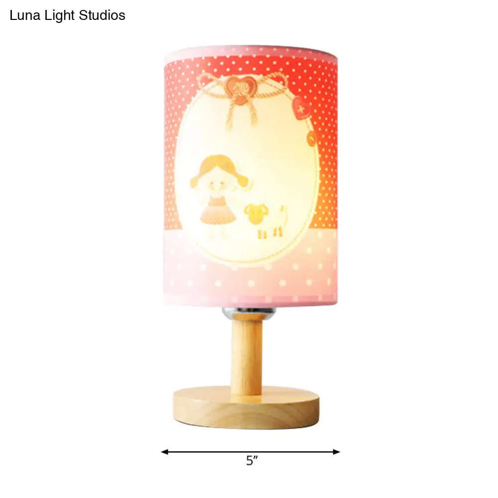 Lámpara de escritorio rosa infantil: Lámpara cilíndrica de tela y madera, ligera y resistente, ideal para la habitación de las niñas.
