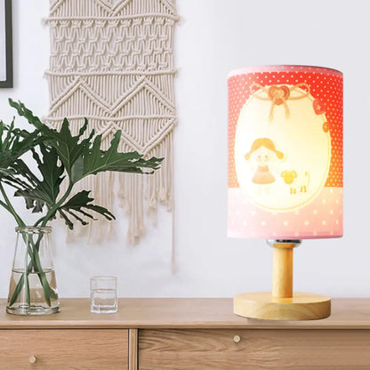 Lámpara de escritorio rosa infantil: Lámpara cilíndrica de tela y madera, ligera y resistente, ideal para la habitación de las niñas.