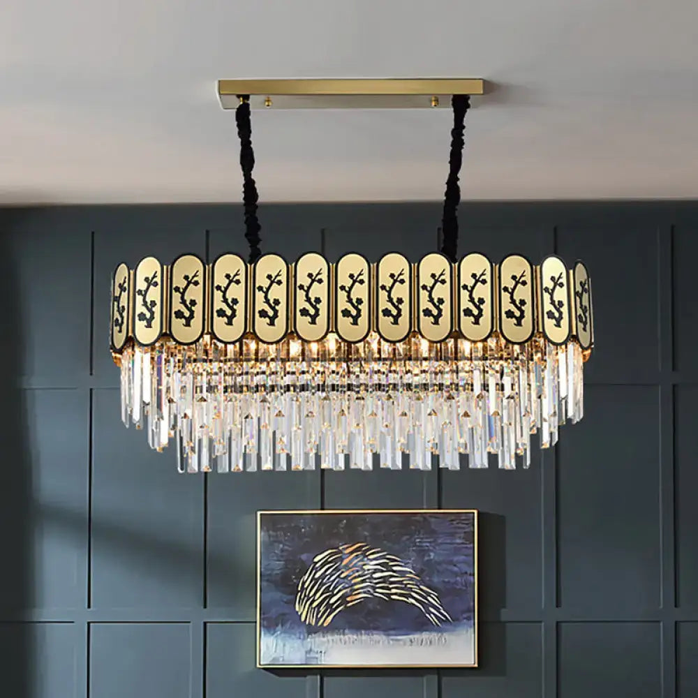 Gold island crystal shaded hanging lamp with gold-toned frame, black cords, and clear crystal prisms on decorative panel