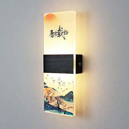 A rectangular wall lamp with glowing acrylic shade featuring a traditional Chinese landscape and black wood-textured accents