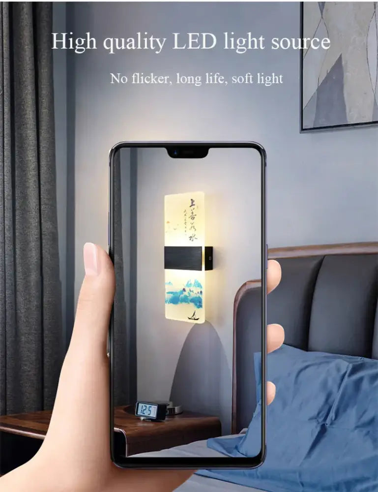 A sleek rectangular wall lamp with an acrylic shade featuring chinese ink landscape and calligraphy decorbites design