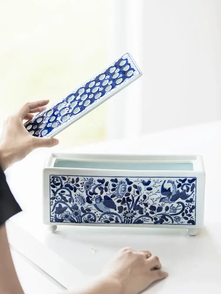 Blue and white ceramic tissue box with intricate floral and bird patterns in white porcelain decorbites blue white style