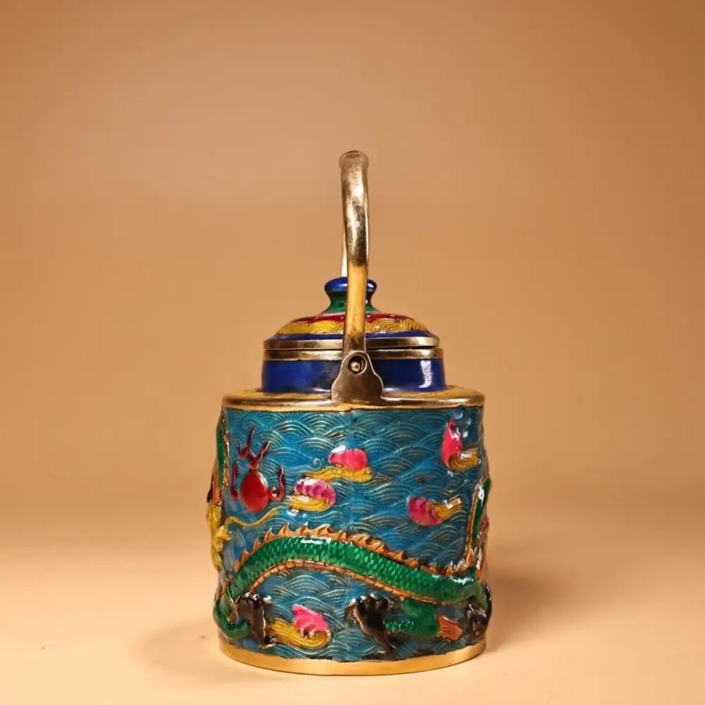 A vibrant blue enamel pan tea caddy with gold handle and decorbites dragon cloisonné design of green dragons and pink fish