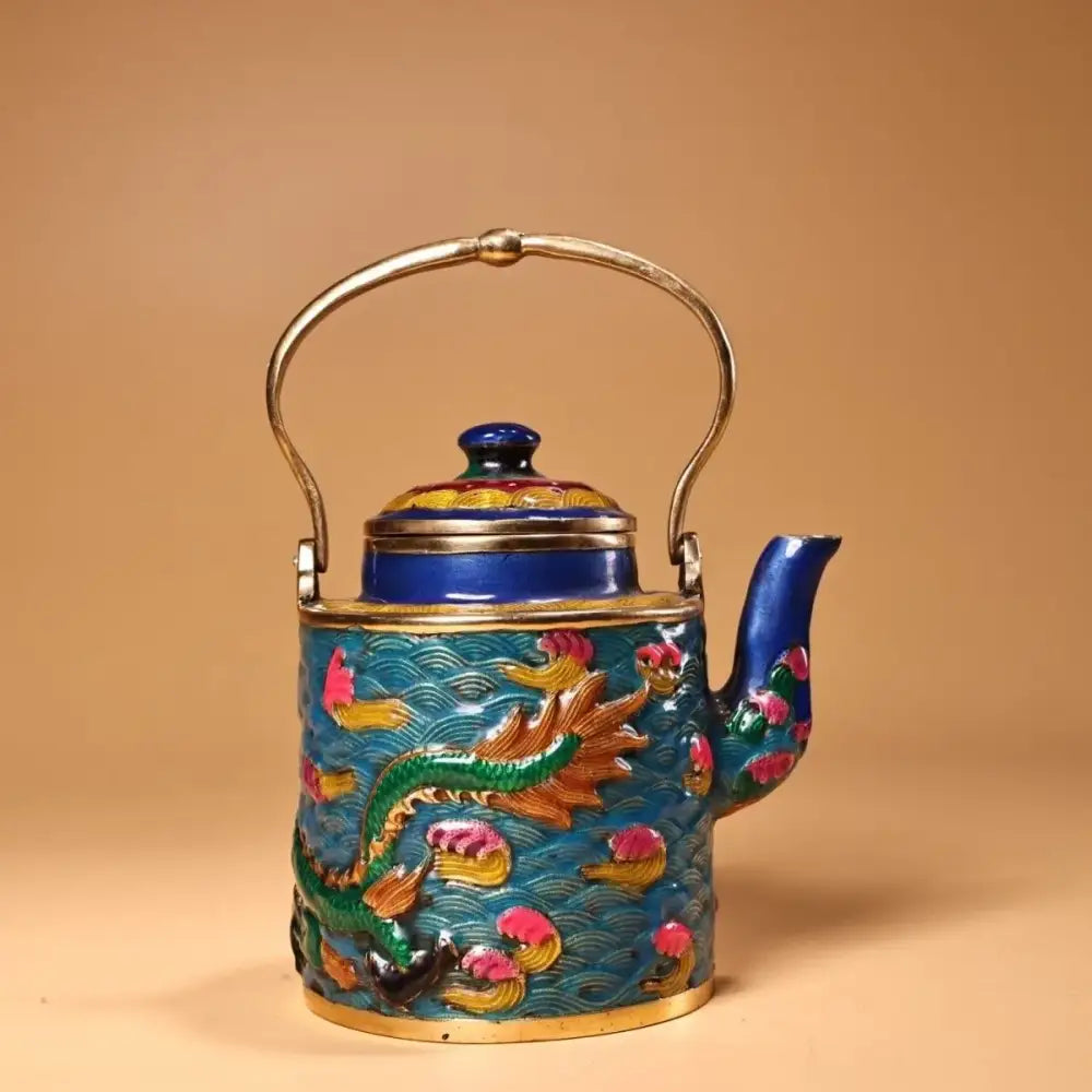 A vibrant blue and gold enamel pan teapot featuring a detailed green dragon decorbites dragon cloisonné design
