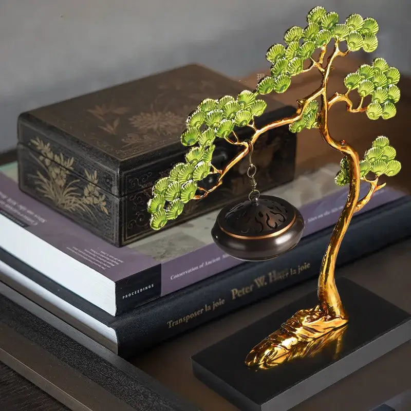 Golden bonsai tree figurine with green fan-shaped leaves and hanging dark bronze incense burner as enamel pine ornaments
