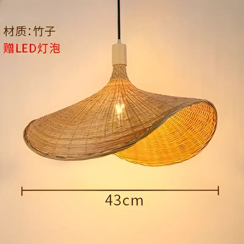 A warm-toned natural bamboo weave pendant lamp with a textured asymmetrical design for dining room lighting