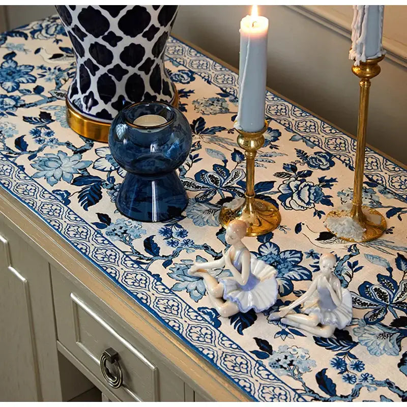 Chinoiserie blue white porcelain table runner with intricate floral pattern and tassels for dining room decorbites blue white decor