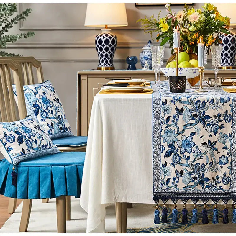 Blue and white porcelain table runner with chinoiserie floral design and tassel trim for dining room decorbites blue white style