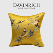 A golden-yellow satin pillow cover from davinrich home featuring birds branches embroidered decorbites design