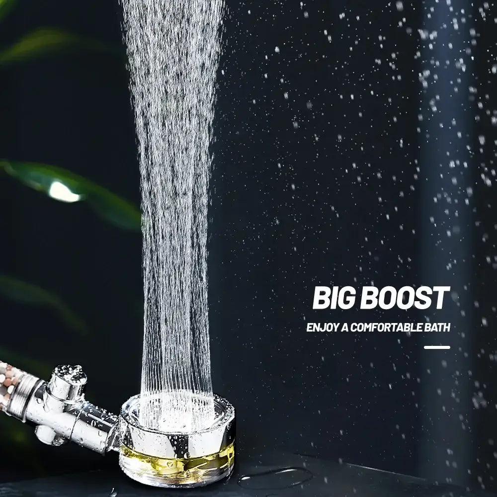 Shiny chrome shower head with golden base featuring a rotating filter shower for an enhanced shower experience