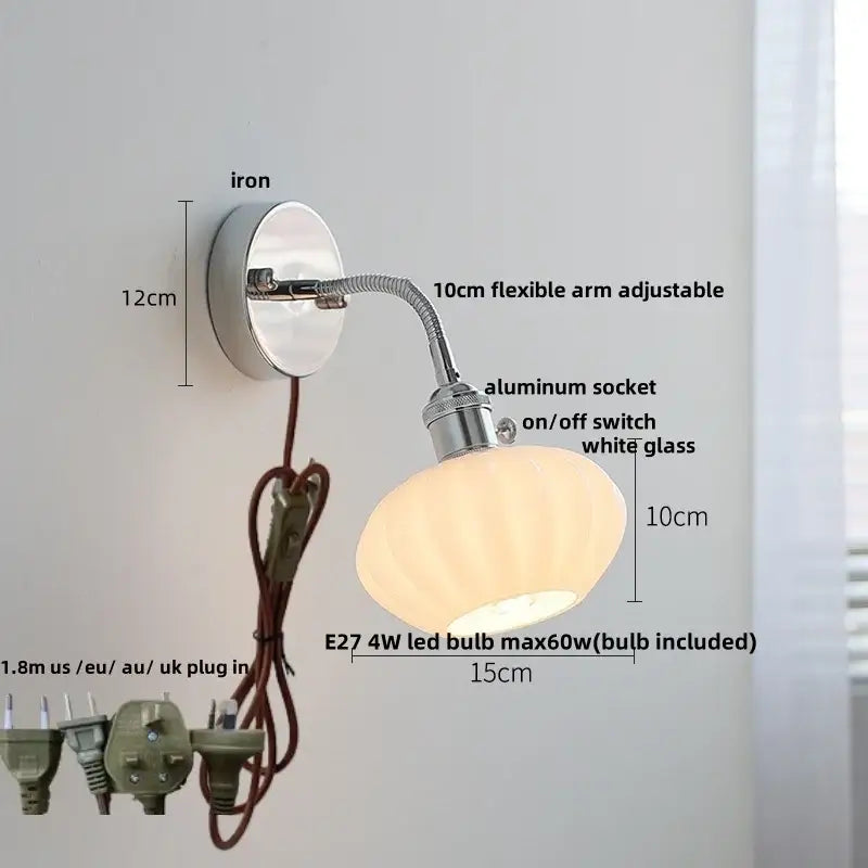 A sleek chrome wall lamp with adjustable arm and white ribbed glass shade featuring an e27 led bulb for bedroom use