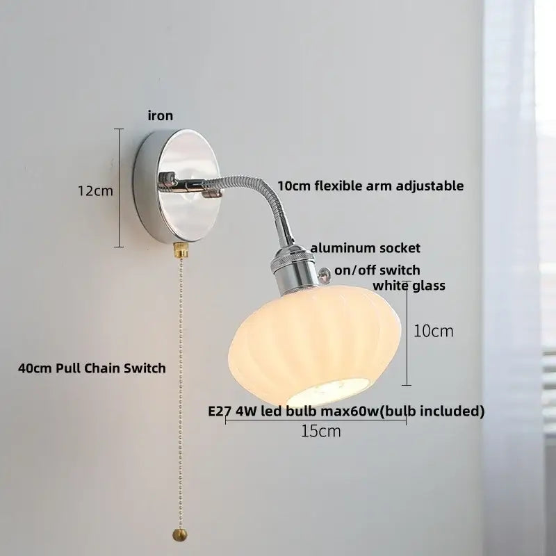 A chrome wall lamp with an adjustable arm and elegant white ribbed glass shade for bedroom decorbites adjustable arm