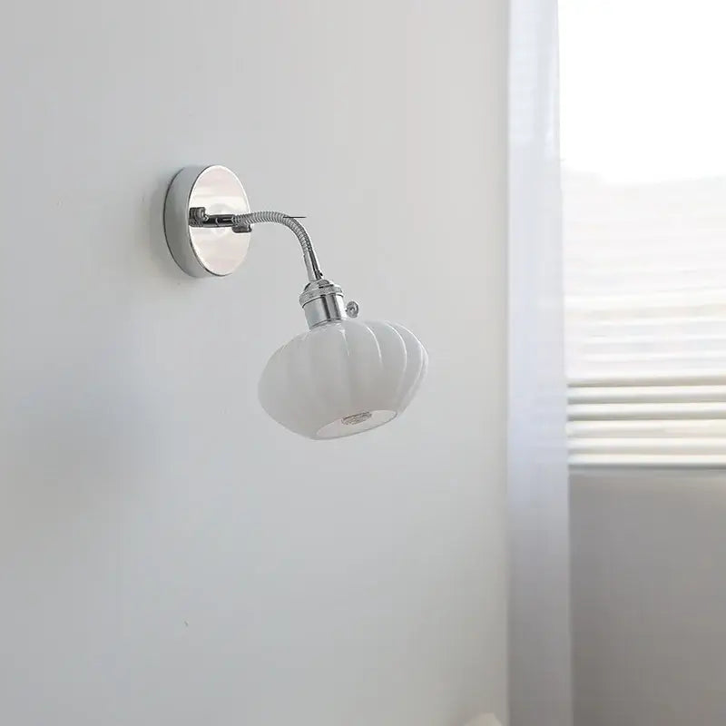 White ceramic wall lamp with a chrome adjustable arm and fluted ribbed glass shade for bedroom decorbites adjustable arm