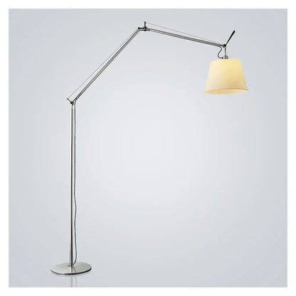 Silver articulated floor lamp with cream fabric shade complementing decorbites adjustable industrial wall light design