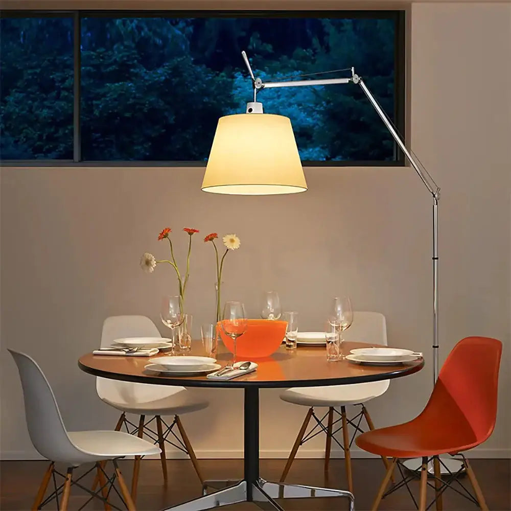 A sleek chrome decorbites adjustable industrial wall light with a metallic arm and warm beige fabric shade for bedroom decor