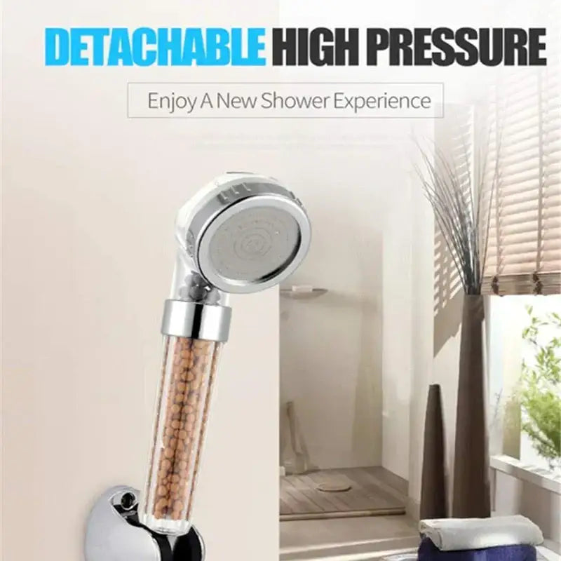 Chrome-finished detachable high-pressure anion spa shower head with transparent body filled with brown decorbites beads