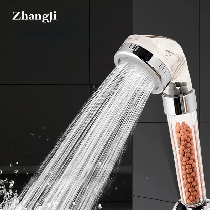 Chrome decorbites anion spa shower head with clear cylindrical housing and orange filtration beads for high pressure use