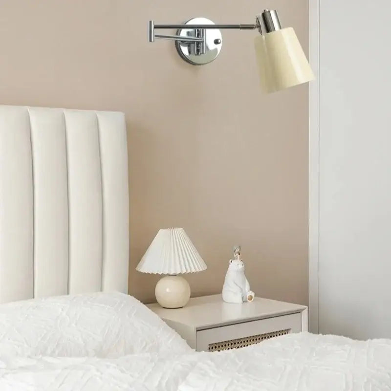 Cream led swing arm wall lamp with cream pleated lampshade and rounded white base for bedroom decorbites cream led