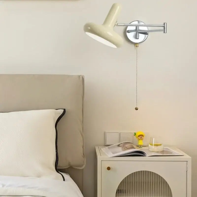 Cream-colored decorbites cream led swing arm wall lamp with chrome base and pull chain for bedroom lighting