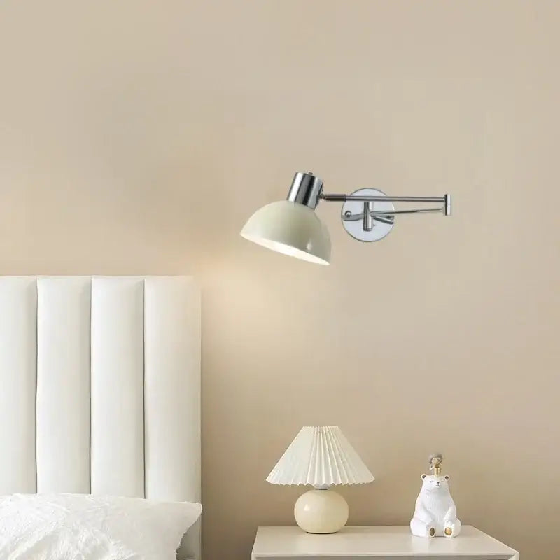 A sleek cream led swing arm wall lamp with matte dome shade and chrome metal arms for bedroom decorbites cream led