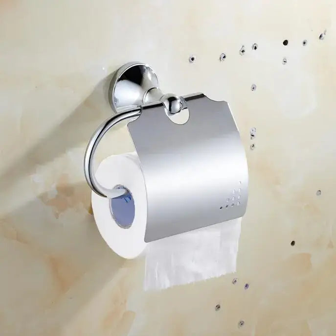 Chrome finished toilet paper holder with sleek curved arm in crystal bathroom set by decorbites brass