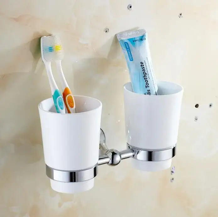 White ceramic toothbrush holder with chrome metal accents and dual cups from crystal bathroom set decorbites brass