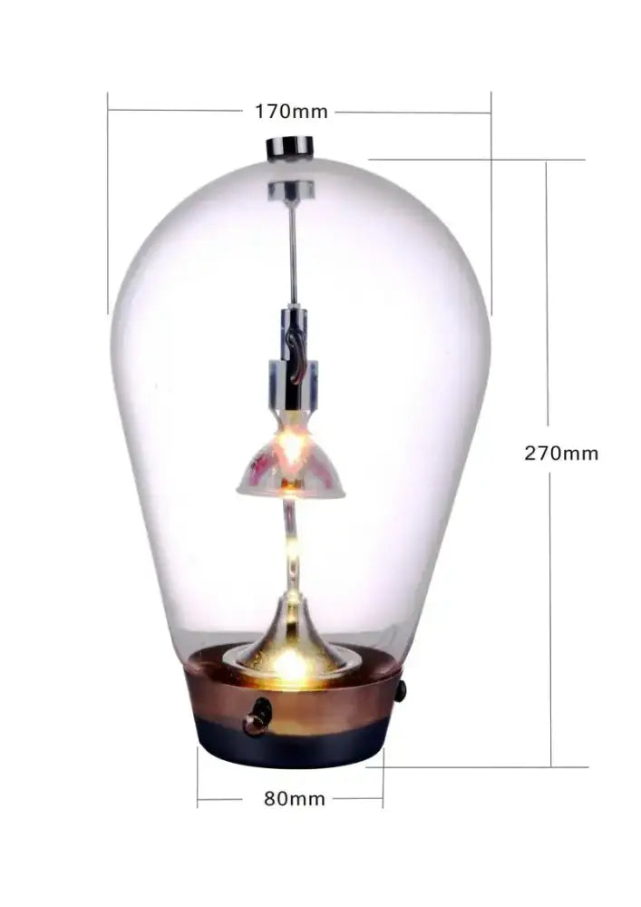 Vintage-style led table lamp with clear glass globe, brass and black metal base, and exposed filament bulb for bedroom use