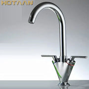 Chrome double handle kitchen sink mixer tap with swivel spout and sleek arched chrome-finished handles for modern use